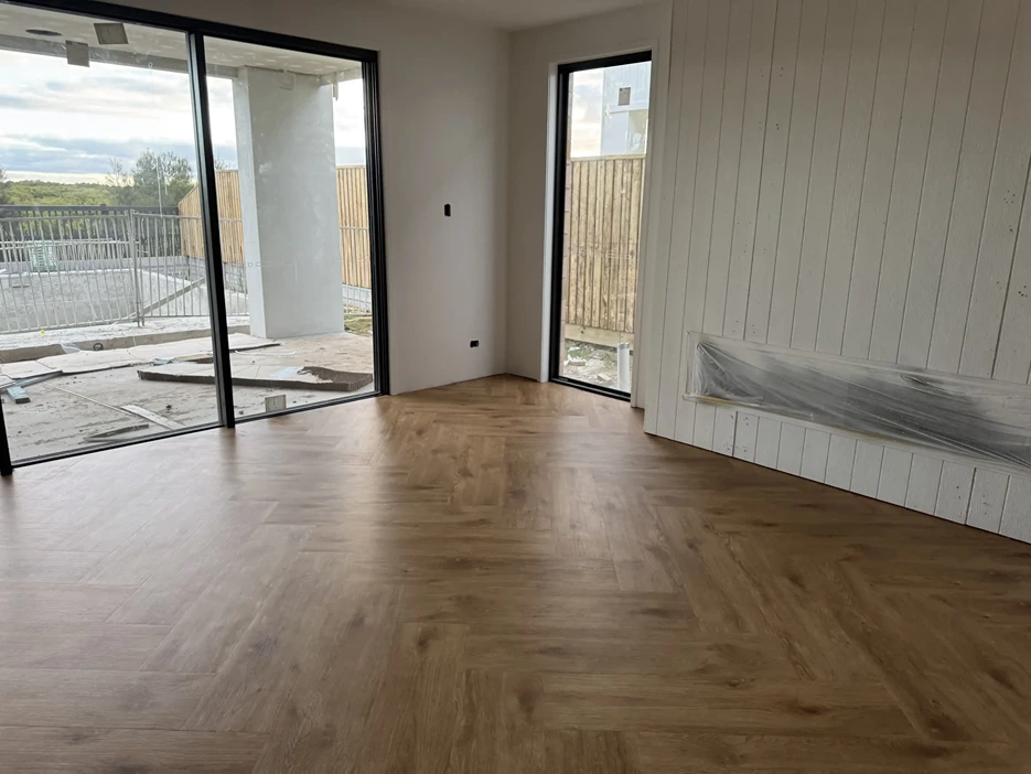 Timber flooring installed in a bright open-plan room